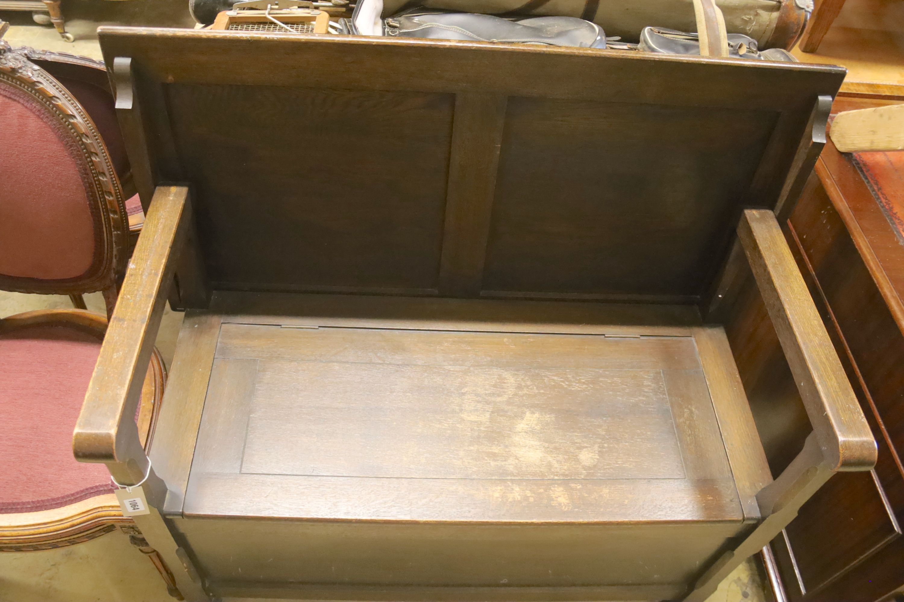 An 18th century style oak monk's bench, width 107cm, depth 54cm, height 99cm